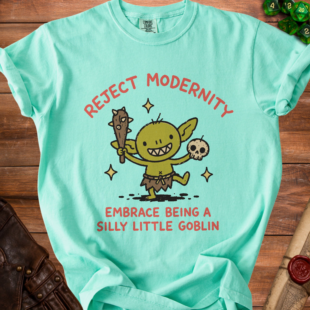 Mint t-shirt with "Reject Modernity Embrace Being a Silly Little Goblin" text and goblin graphic.
