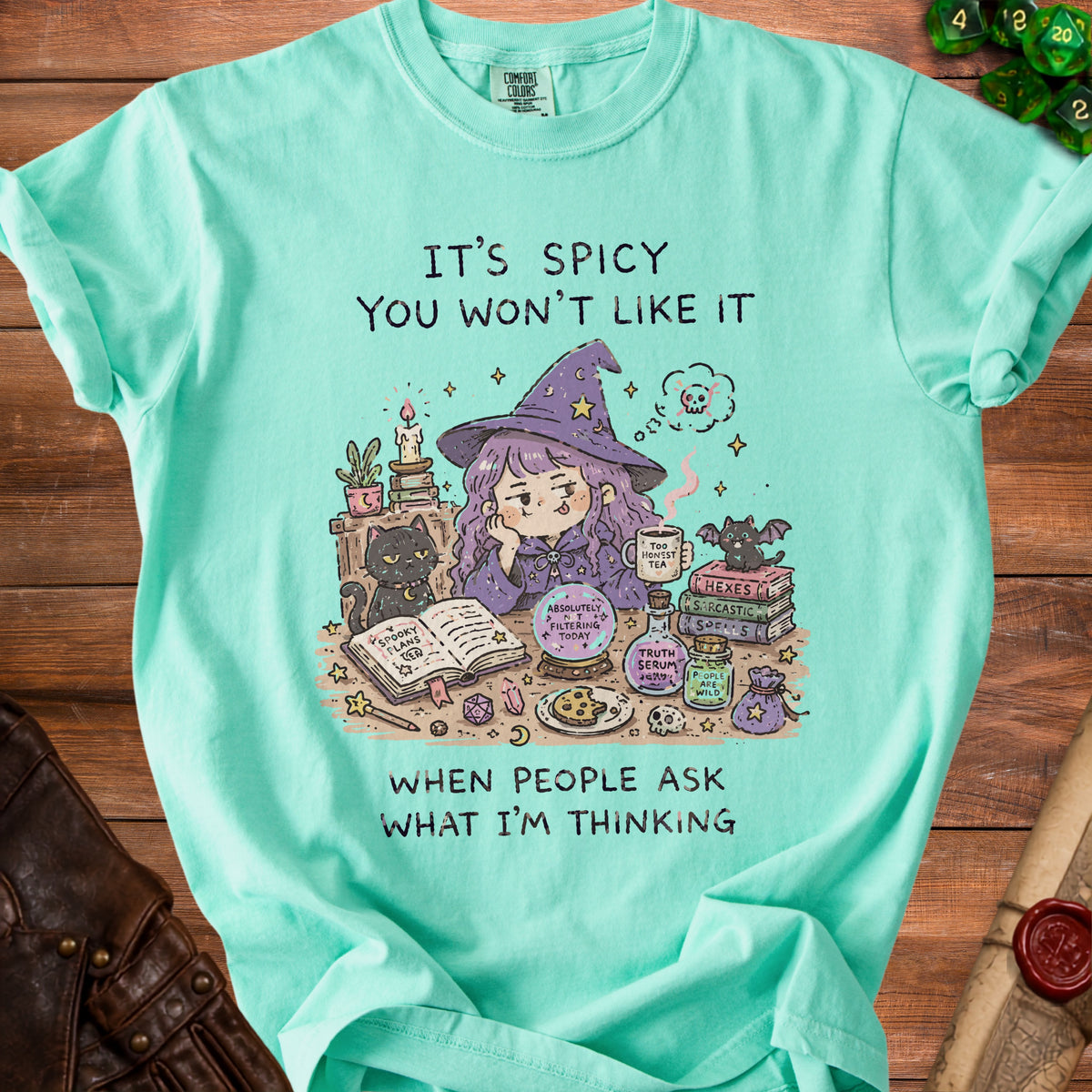 Aqua t-shirt with witch graphic and text "IT'S SPICY YOU WON'T LIKE IT WHEN PEOPLE ASK WHAT I'M THINKING."