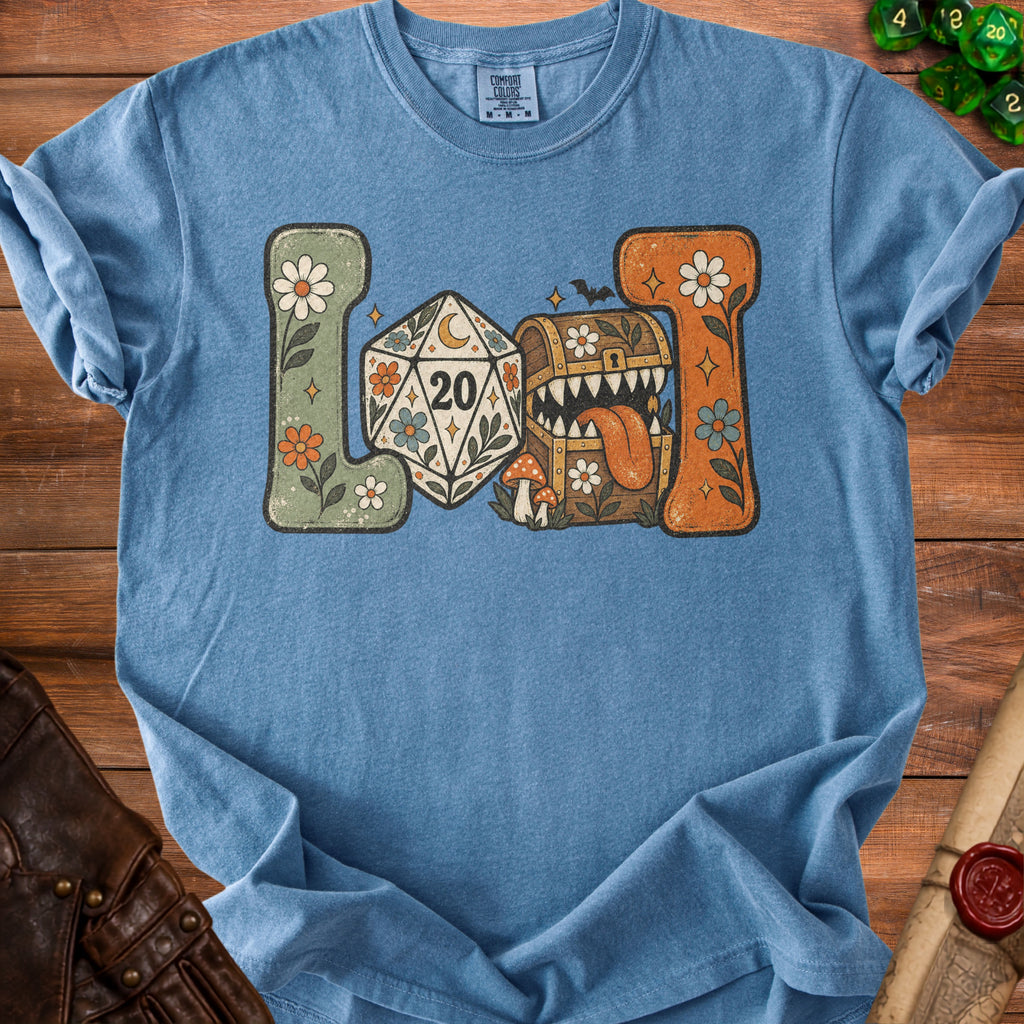 Blue t-shirt with a distressed graphic of a D20 dice, treasure chest, and flowers.