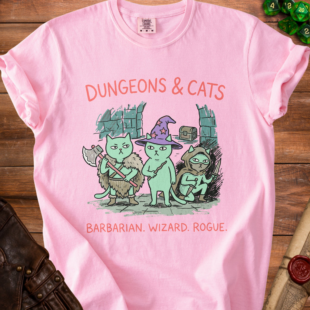 Pink t-shirt with "Dungeons & Cats" and barbarian, wizard, rogue cats.