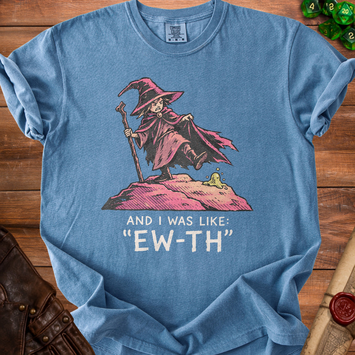 Blue t-shirt with a cartoon wizard graphic and text "AND I WAS LIKE: 'EW-TH'".