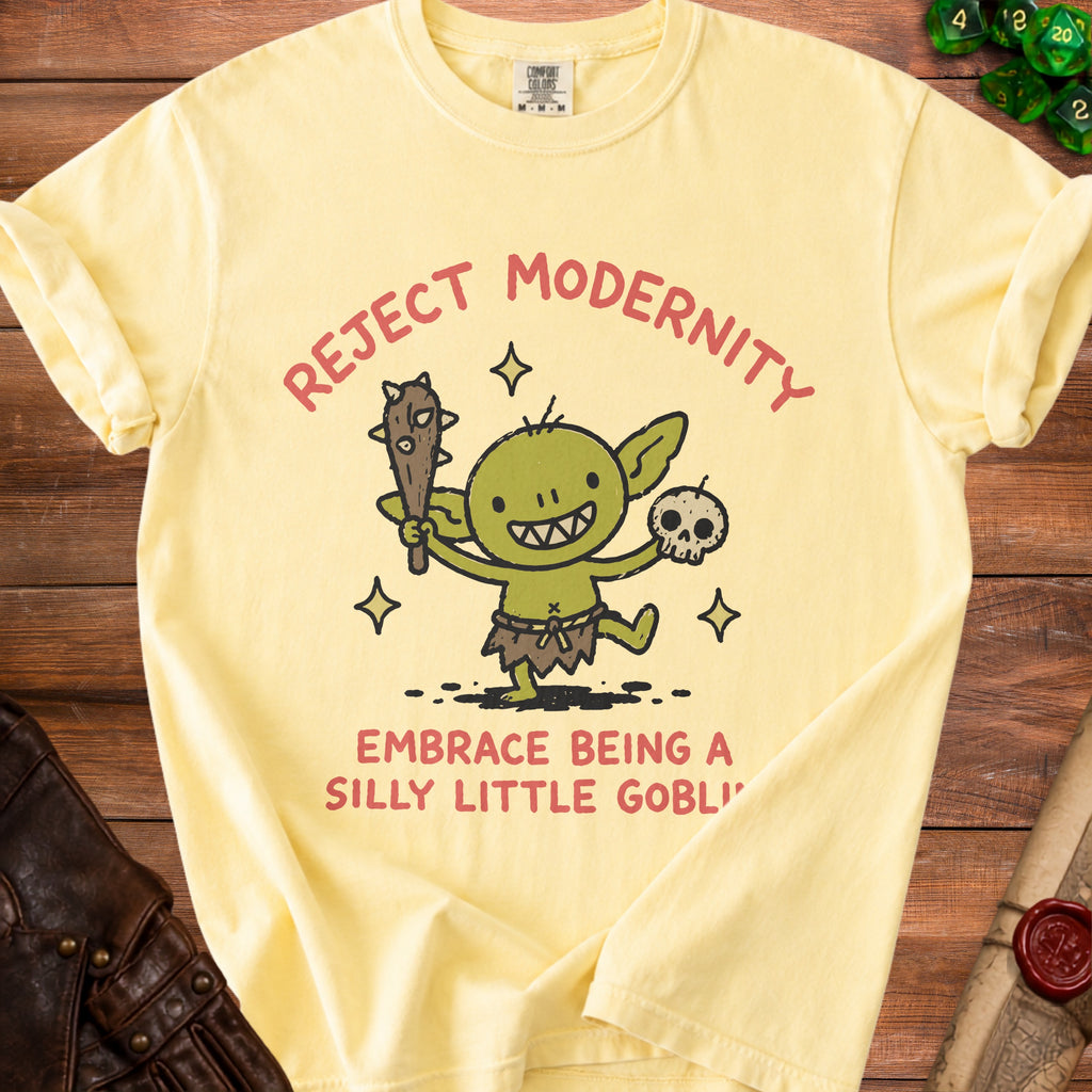 Yellow t-shirt with a goblin graphic and text: "Reject Modernity Embrace Being A Silly Little Goblin".