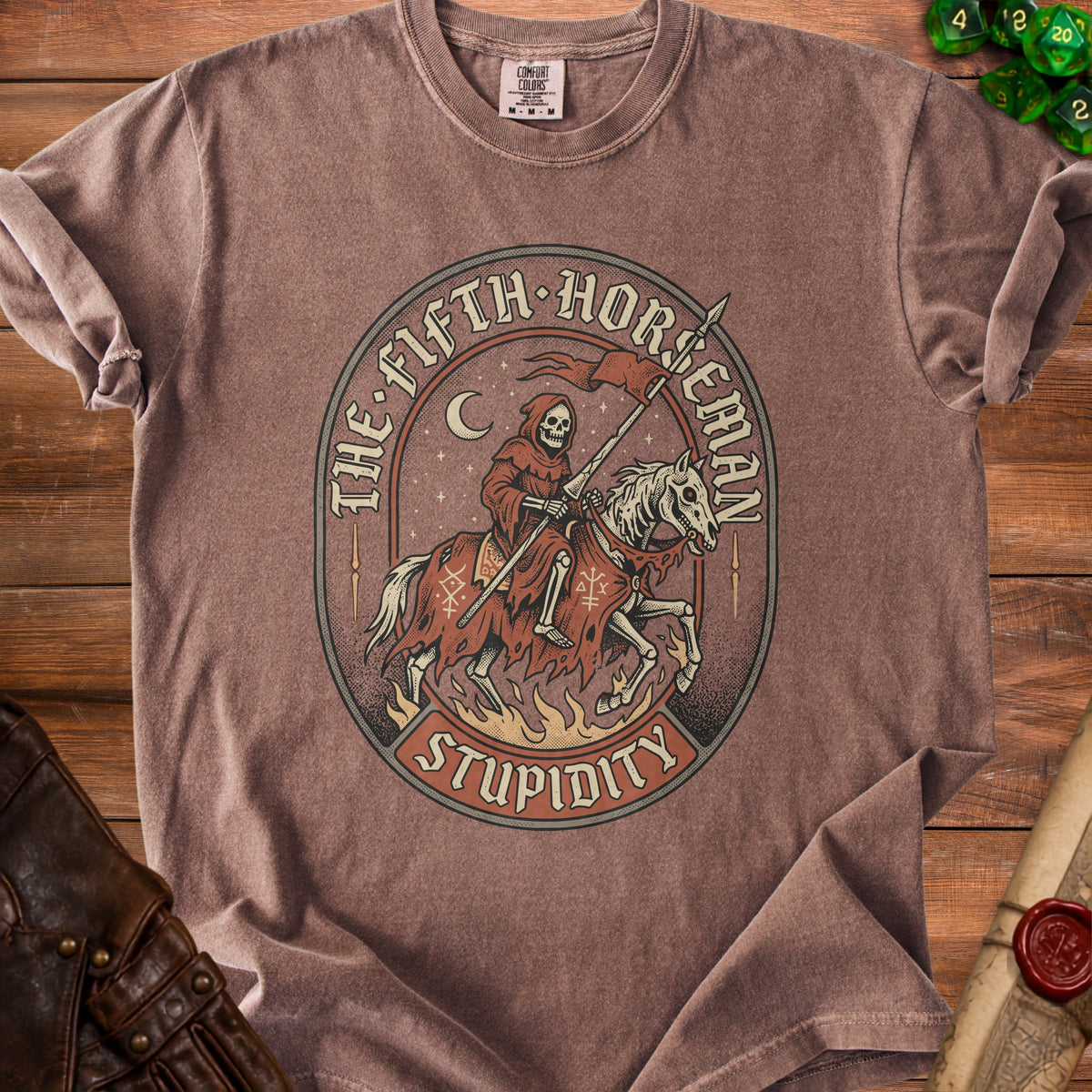 Brown t-shirt with graphic of skeleton grim reaper on horseback, "The Fifth Horseman Stupidity".