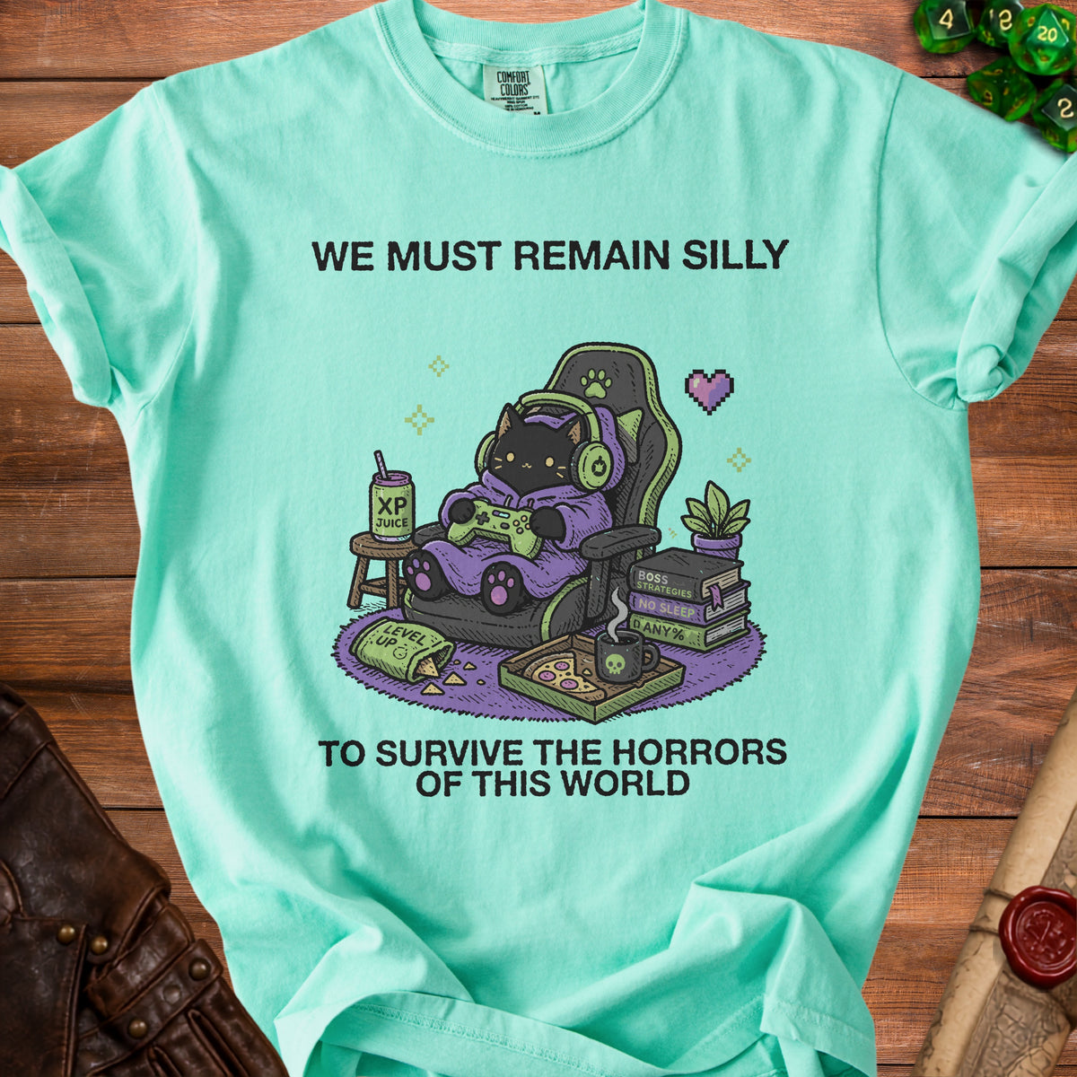 Black cat gamer with headphones and gaming chair, "We must remain silly to survive the horrors of this world."