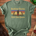 Green t-shirt with text "Bedtime Stories Have Side Quests" and an illustration of a book with a castle.