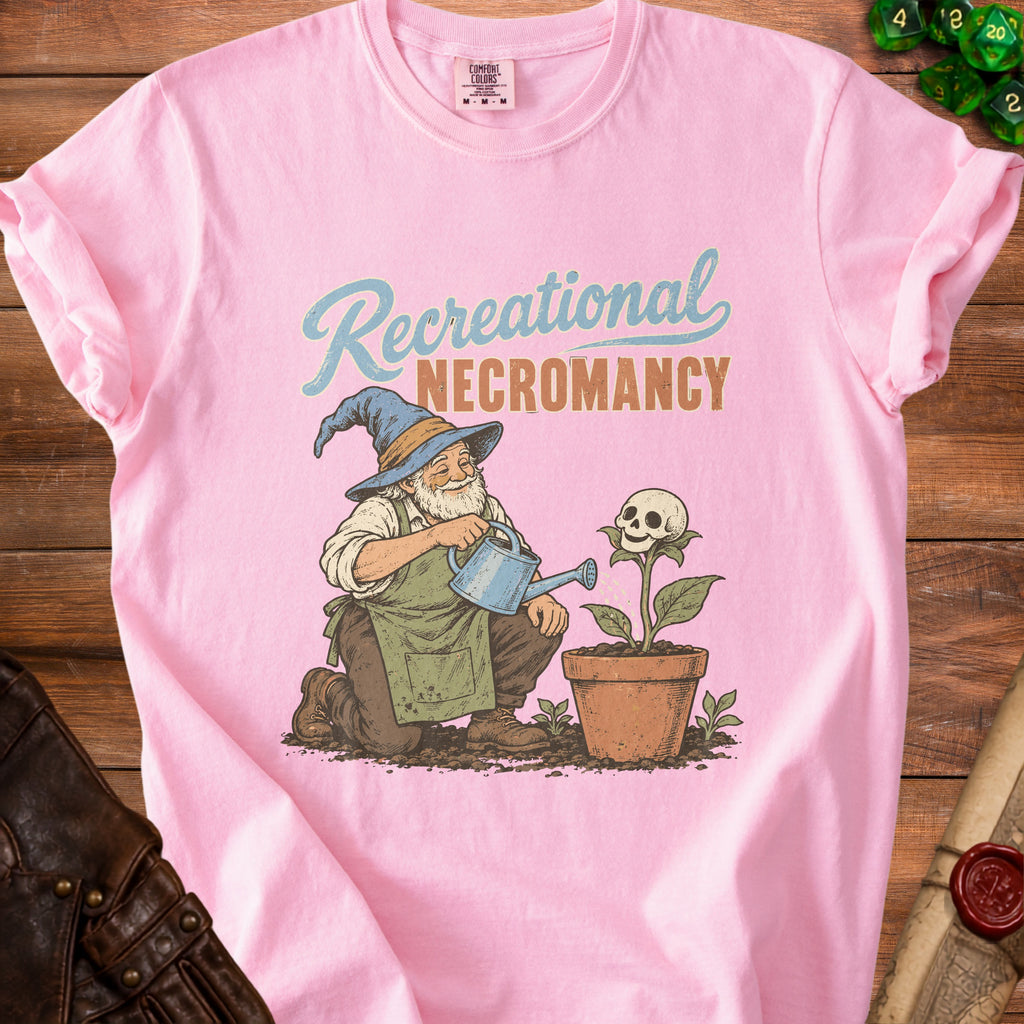 Pink t-shirt with "Recreational Necromancy" text and wizard watering a skull-flower.