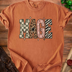 Orange t-shirt with "MAGE" in patterned letters and stars.