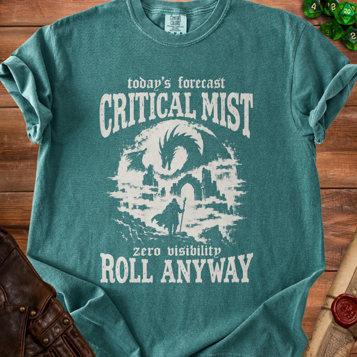 Teal t-shirt with "today's forecast CRITICAL MIST zero visibility ROLL ANYWAY" text and dragon art.