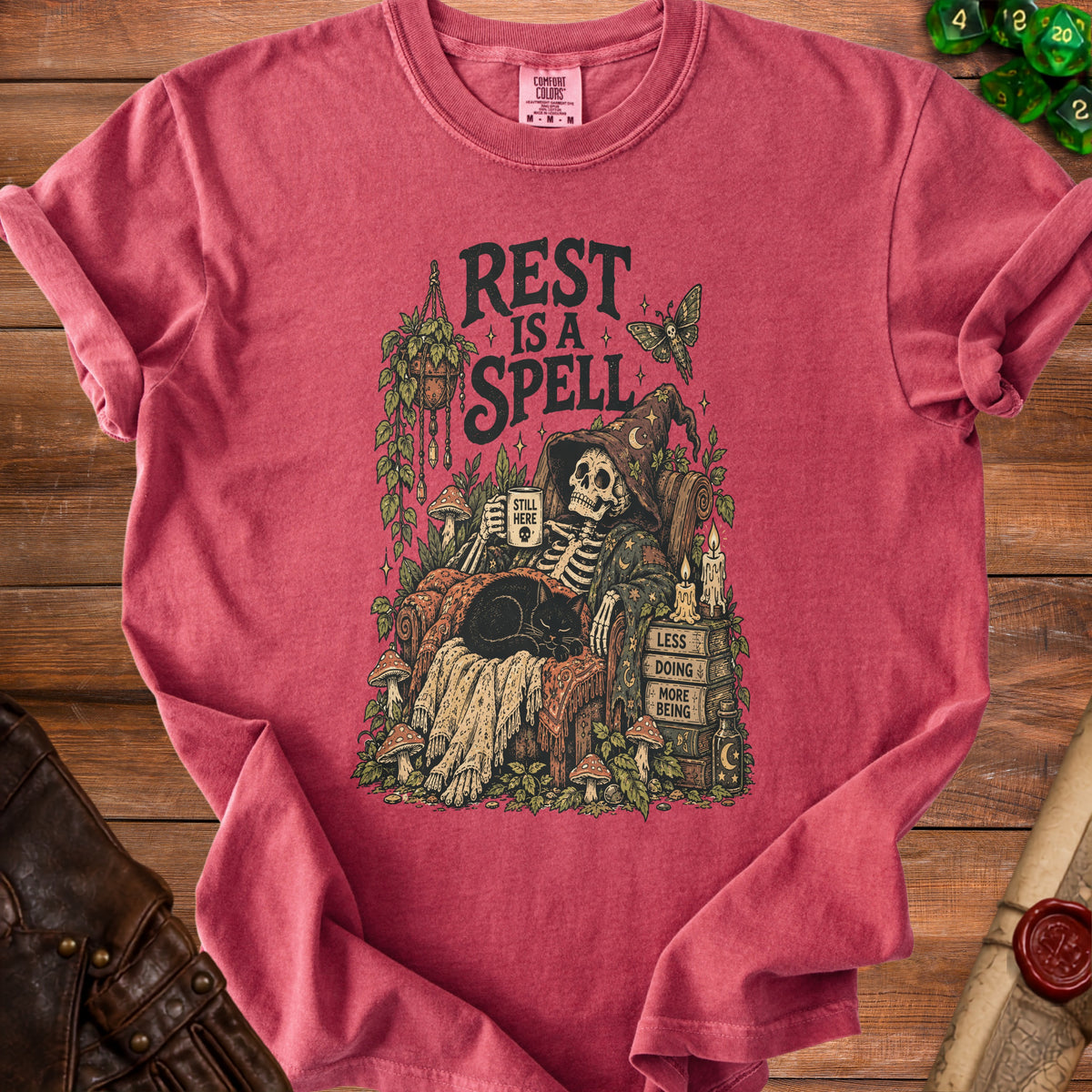 Skeleton with cat and mug, "Rest is a Spell" text.