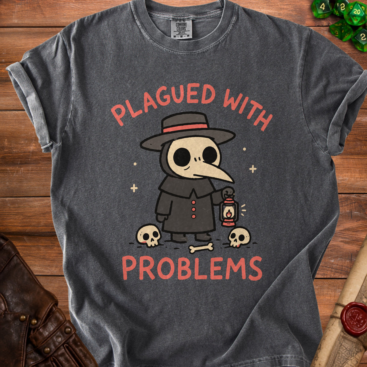 Dark grey t-shirt with cartoon plague doctor and text "PLAGUED WITH PROBLEMS".