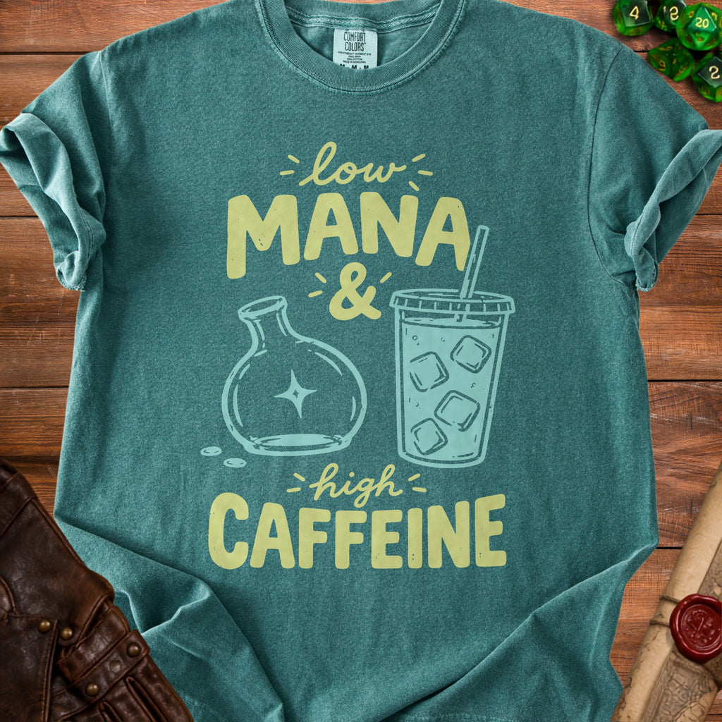 Teal t-shirt with "Low Mana & High Caffeine" graphic featuring a flask and iced coffee.