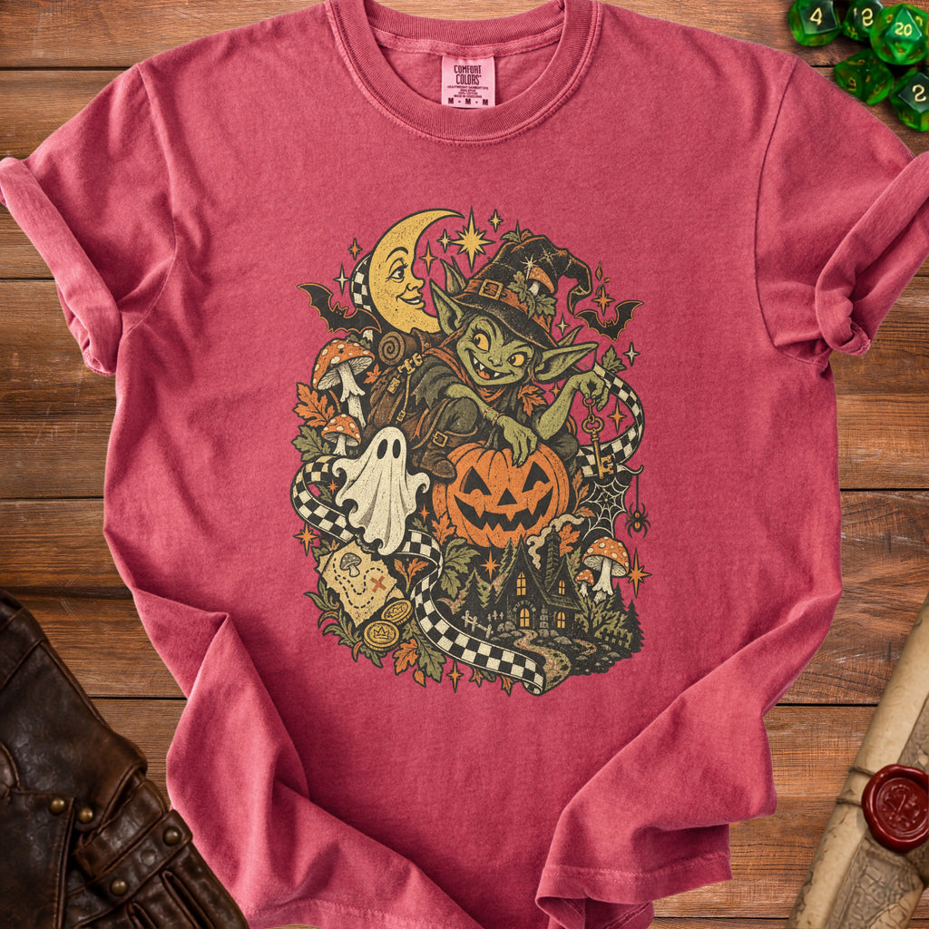 Red t-shirt with a Halloween goblin, moon, pumpkin, ghost, and haunted house design.