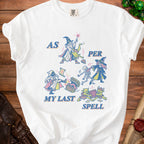 White t-shirt with a graphic depicting wizards, goblins, a skeleton, and a treasure chest with the text "AS PER MY LAST SPELL".