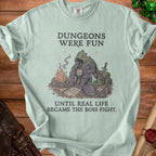 Light blue t-shirt with "Dungeons Were Fun Until Real Life Became The Boss Fight."