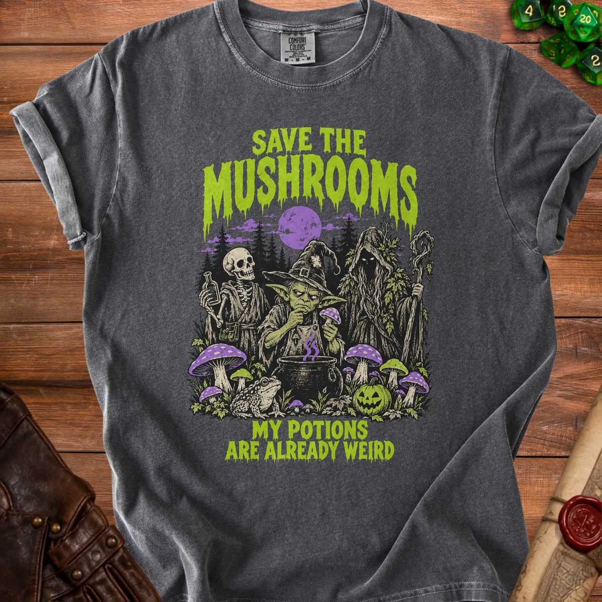 Dark grey t-shirt with "Save the Mushrooms" and "My Potions Are Already Weird" text and spooky illustration.