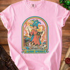 Pink t-shirt with wizard and dragon graphic and "LEARNING EXPERIENCE" text.