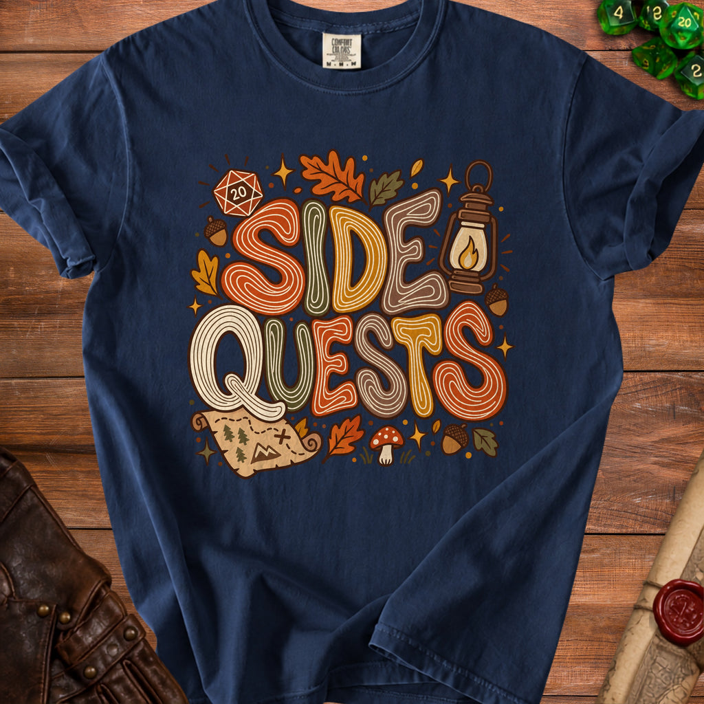 Navy t-shirt with "SIDE QUESTS" text and D20, map, and autumn motifs.