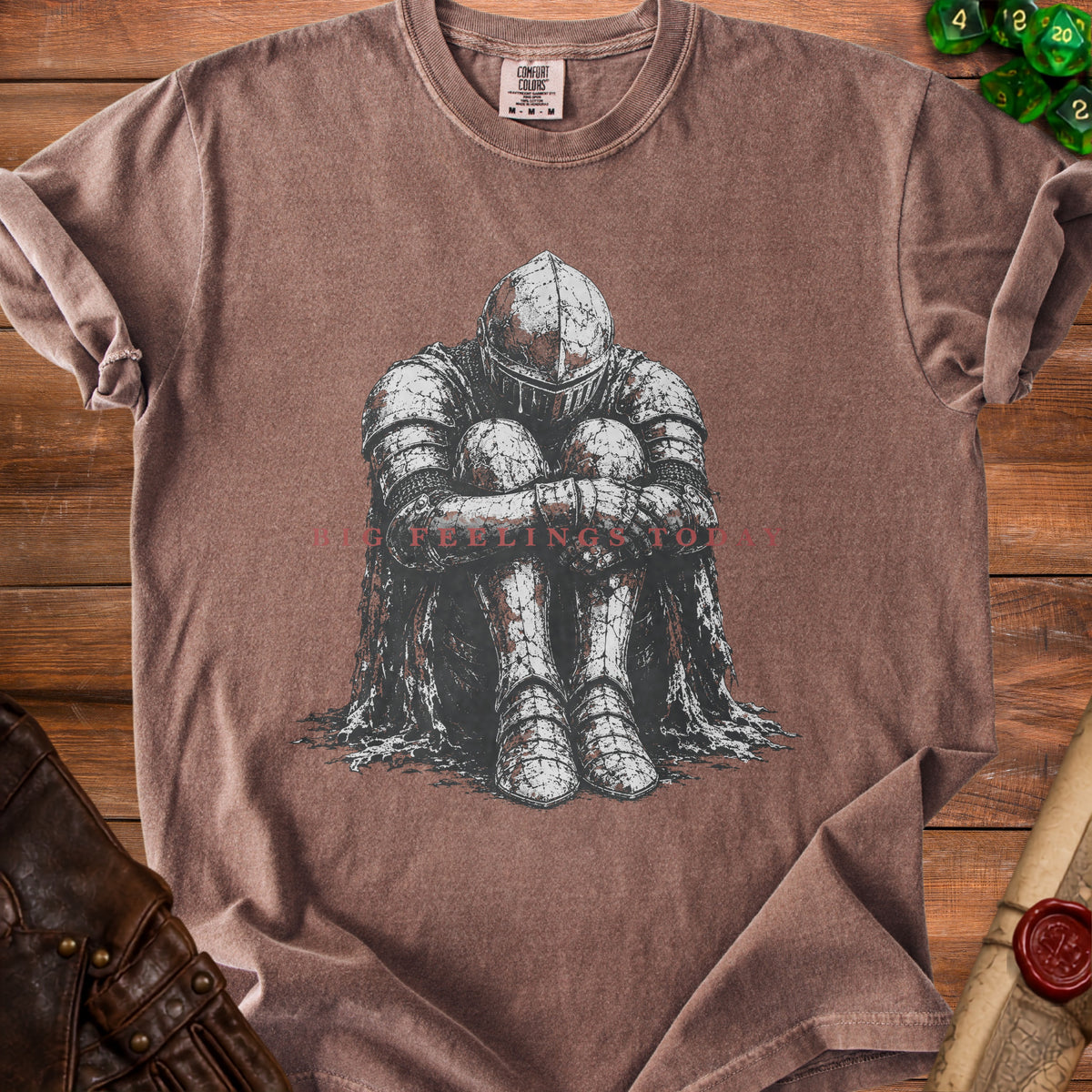 Brown t-shirt with graphic of armored knight and text "BIG FEELINGS TOD".