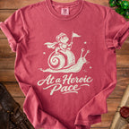 Red t-shirt with a graphic of a knight frog riding a snail with text "At a Heroic Pace".