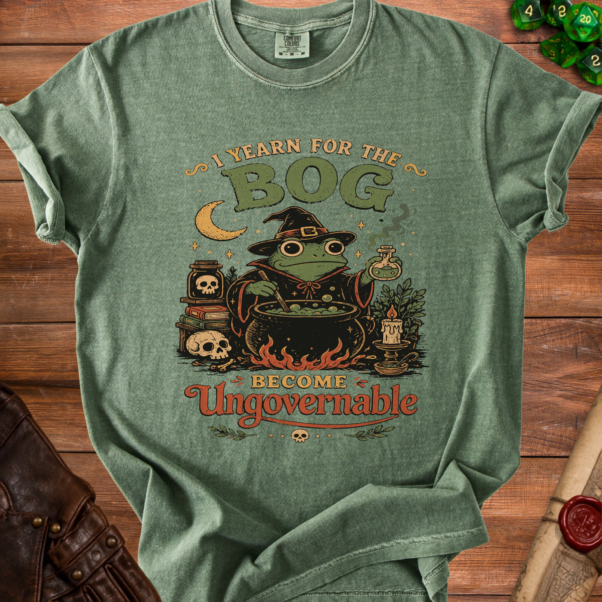 Green t-shirt with frog wizard and text "I YEARN FOR THE BOG BECOME Ungovernable".