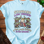 Light blue t-shirt with "Standard Lads Weekend" and goblins.