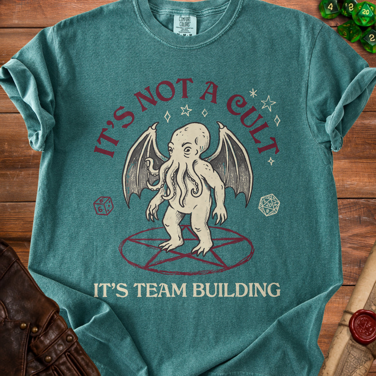 T-shirt with Cthulhu illustration and text "IT'S NOT A CULT IT'S TEAM BUILDING".