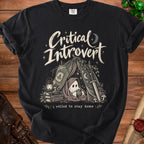 Black t-shirt with "Critical Introvert" text, a ghost holding a D20, and "I rolled to stay home" slogan.