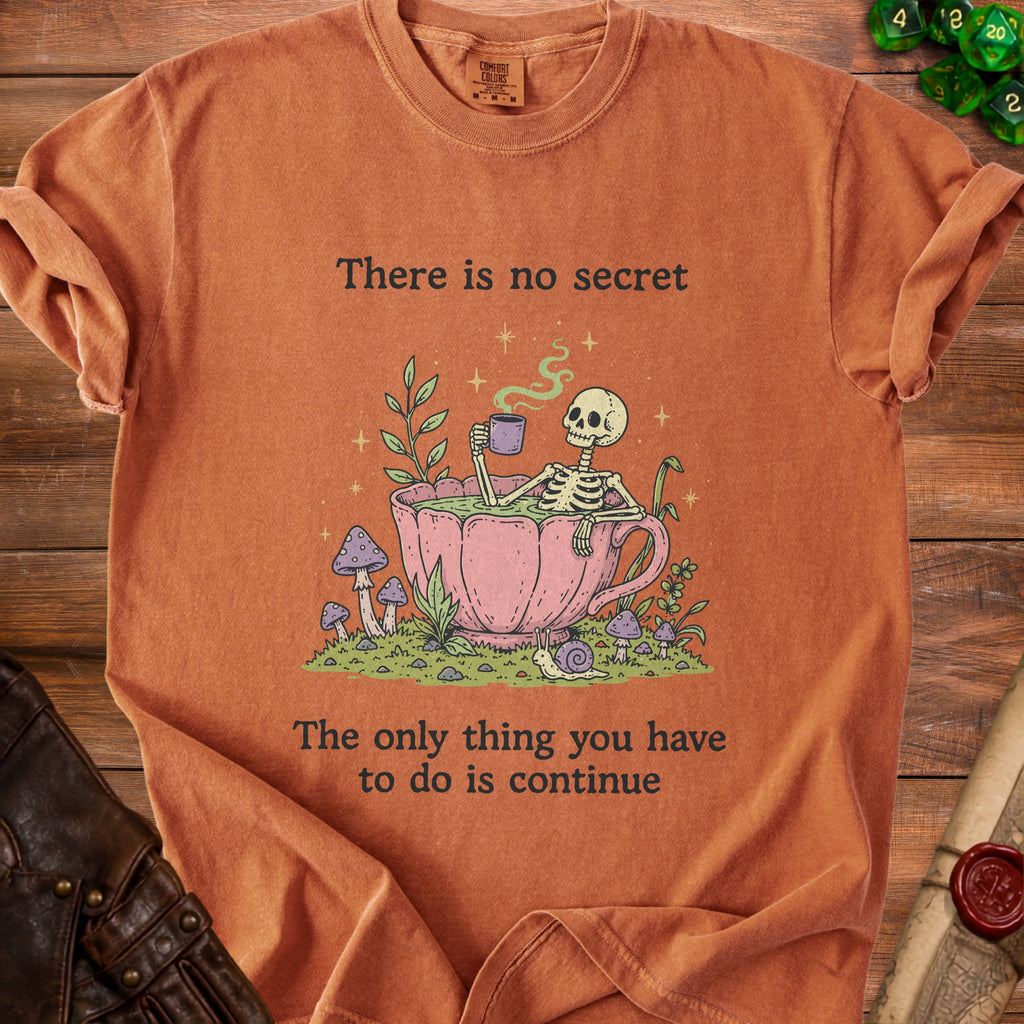 Orange t-shirt with a skeleton in a teacup and text.