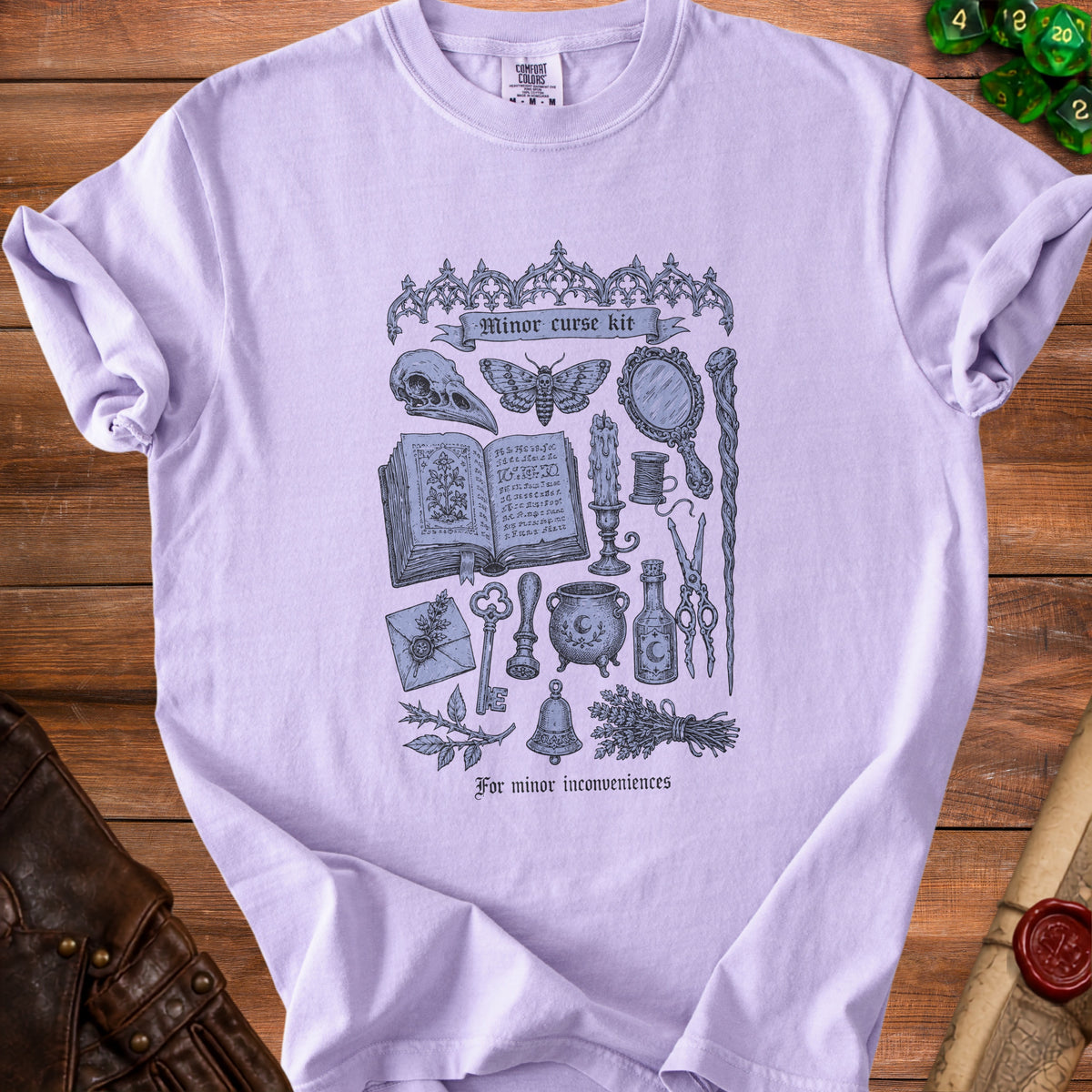 Light purple t-shirt with "Minor curse kit" graphic featuring occult items and text.