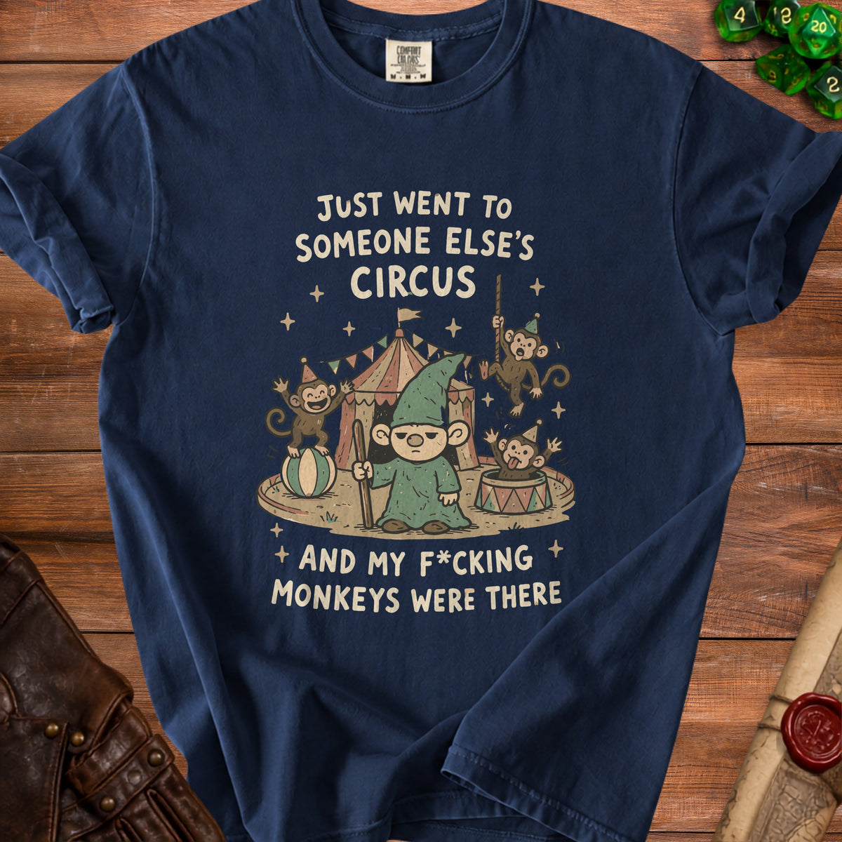 Dark navy t-shirt with graphic of a gnome and monkeys at a circus, text "Just went to someone else's circus and my f*cking monkeys were there."