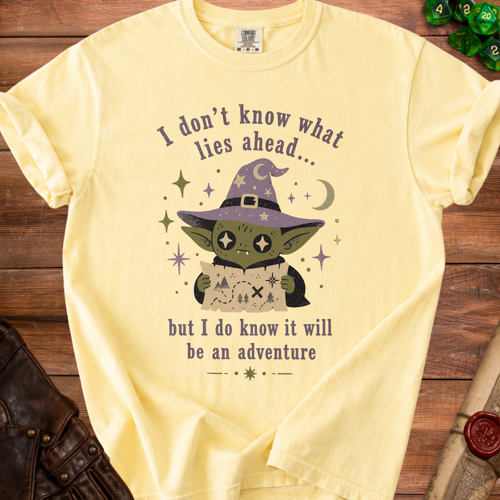 Yellow t-shirt with graphic of a goblin in a wizard hat holding a map.