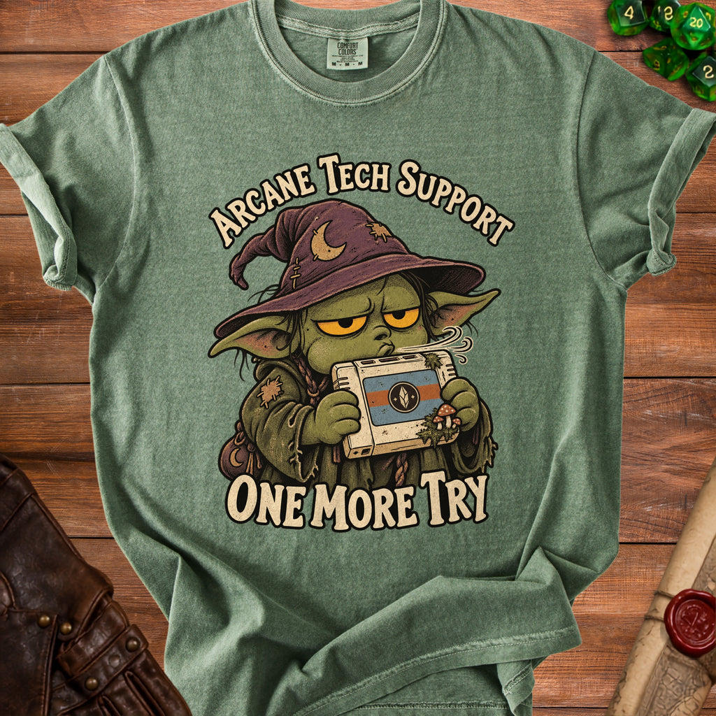 Green t-shirt with cartoon character and text "Arcane Tech Support One More Try".