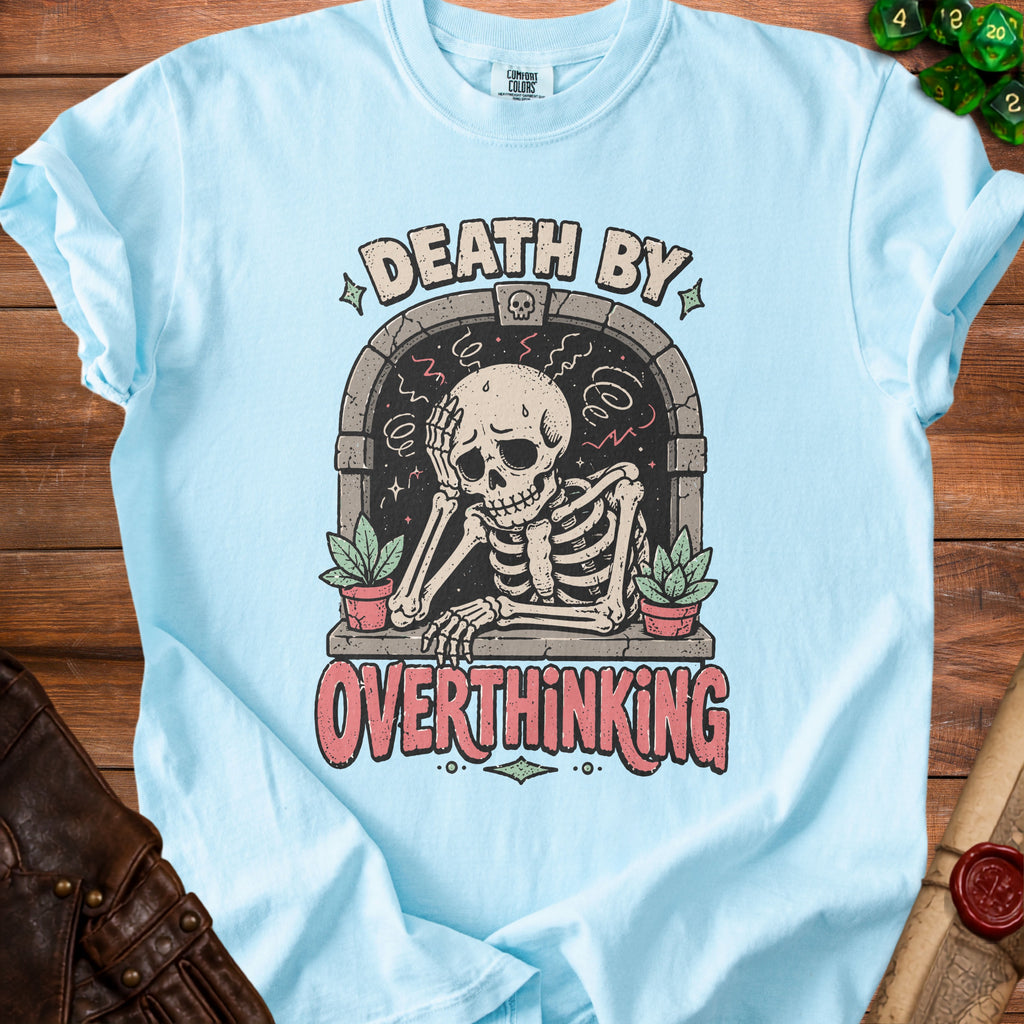 Light blue t-shirt with skeleton graphic reading "DEATH BY OVERTHINKING."