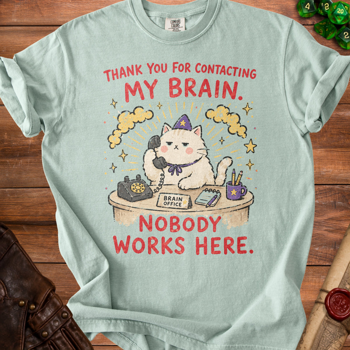 Light blue t-shirt graphic with a cat on the phone saying "Thank you for contacting my brain. Nobody works here."