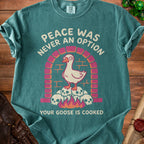 Teal t-shirt with goose on skulls and text "Peace Was Never An Option Your Goose Is Cooked".