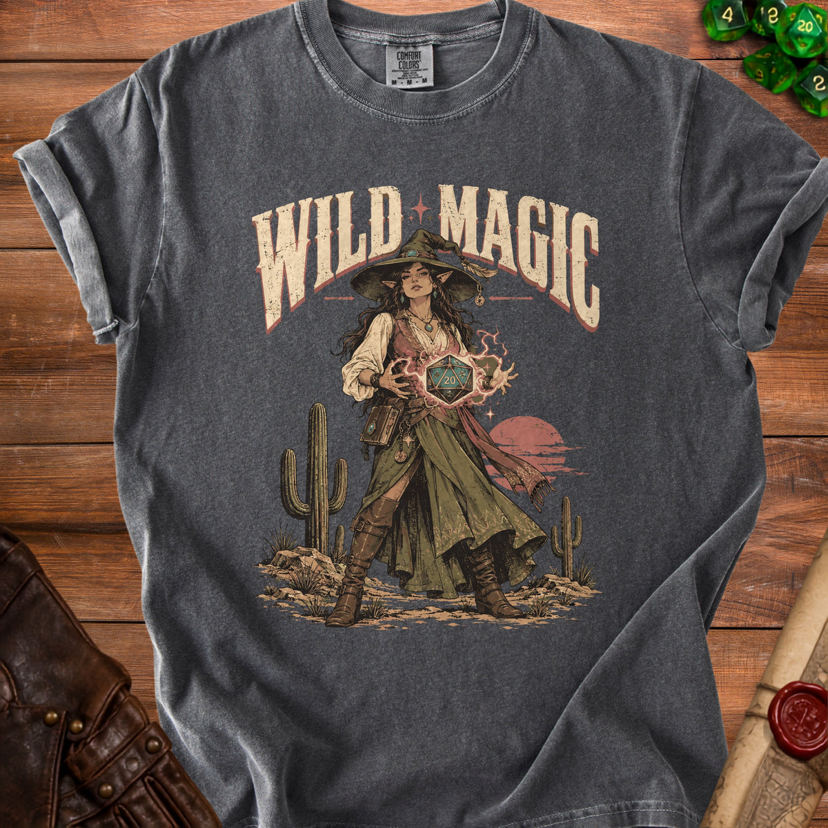 Dark gray t-shirt with "Wild Magic" text and a wizard holding a d20 die.