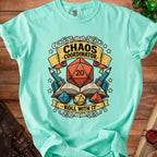 Teal t-shirt with "Chaos Coordinator" and "Roll With It" text, dice, and books design.