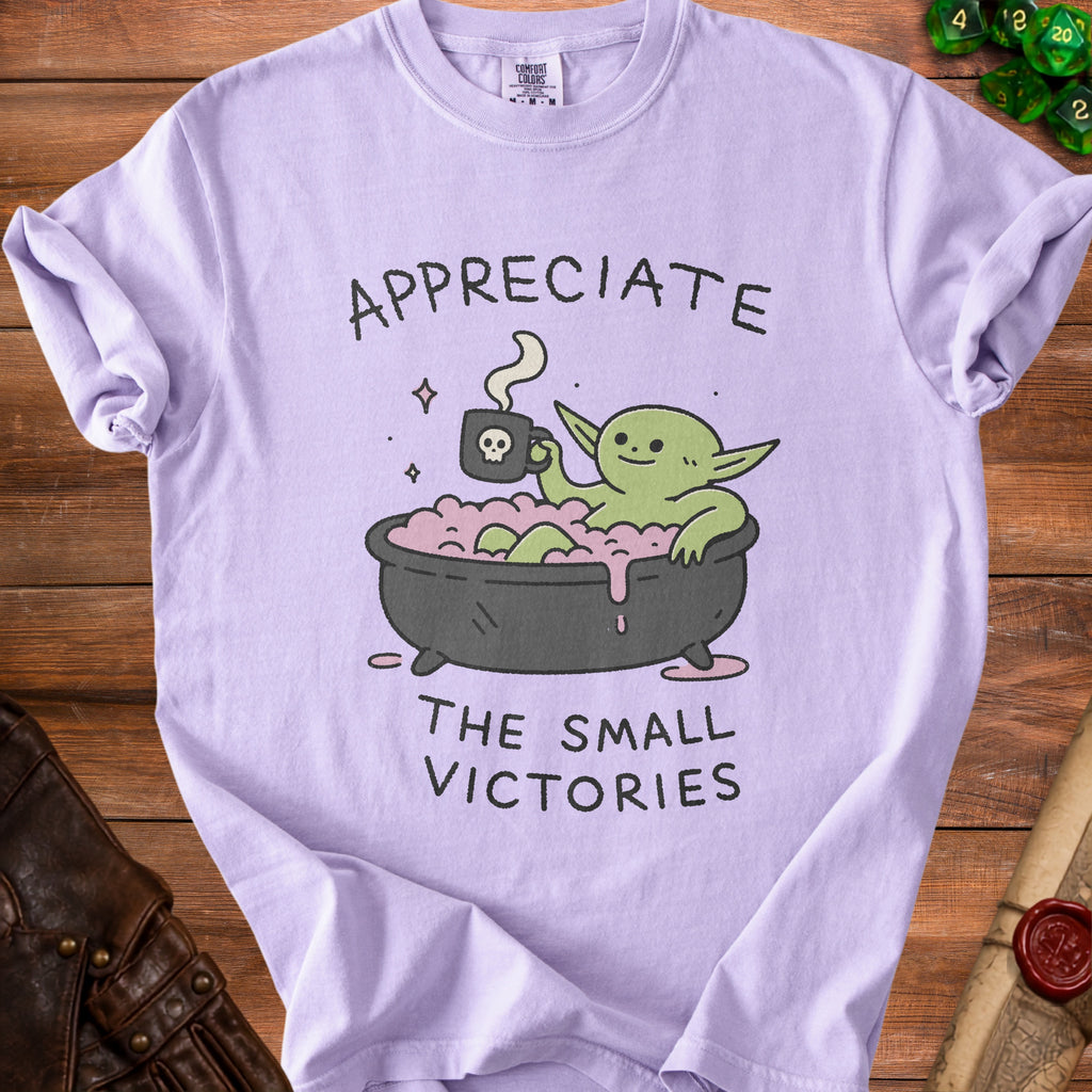 Light purple t-shirt with green creature in a bath and text "Appreciate the small victories".