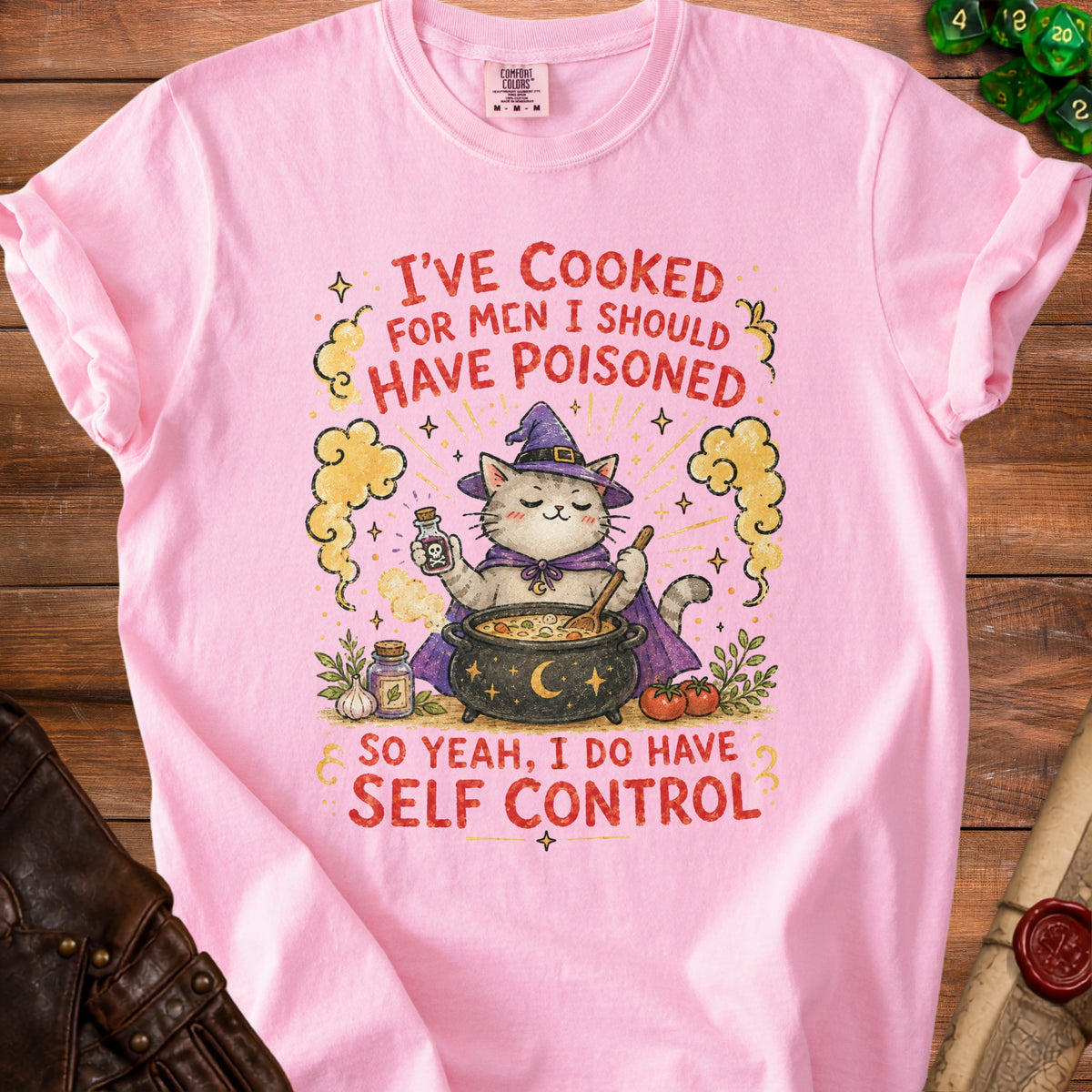 Pink t-shirt with a cat in a witch hat making soup and text about self control.