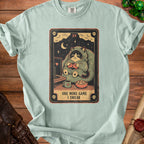 T-shirt with graphic of a cat playing video games and text "ONE MORE GAME I SWEAR".