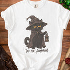 White t-shirt with a black cat in a wizard hat holding a lantern and text "DO NOT SUMMON".