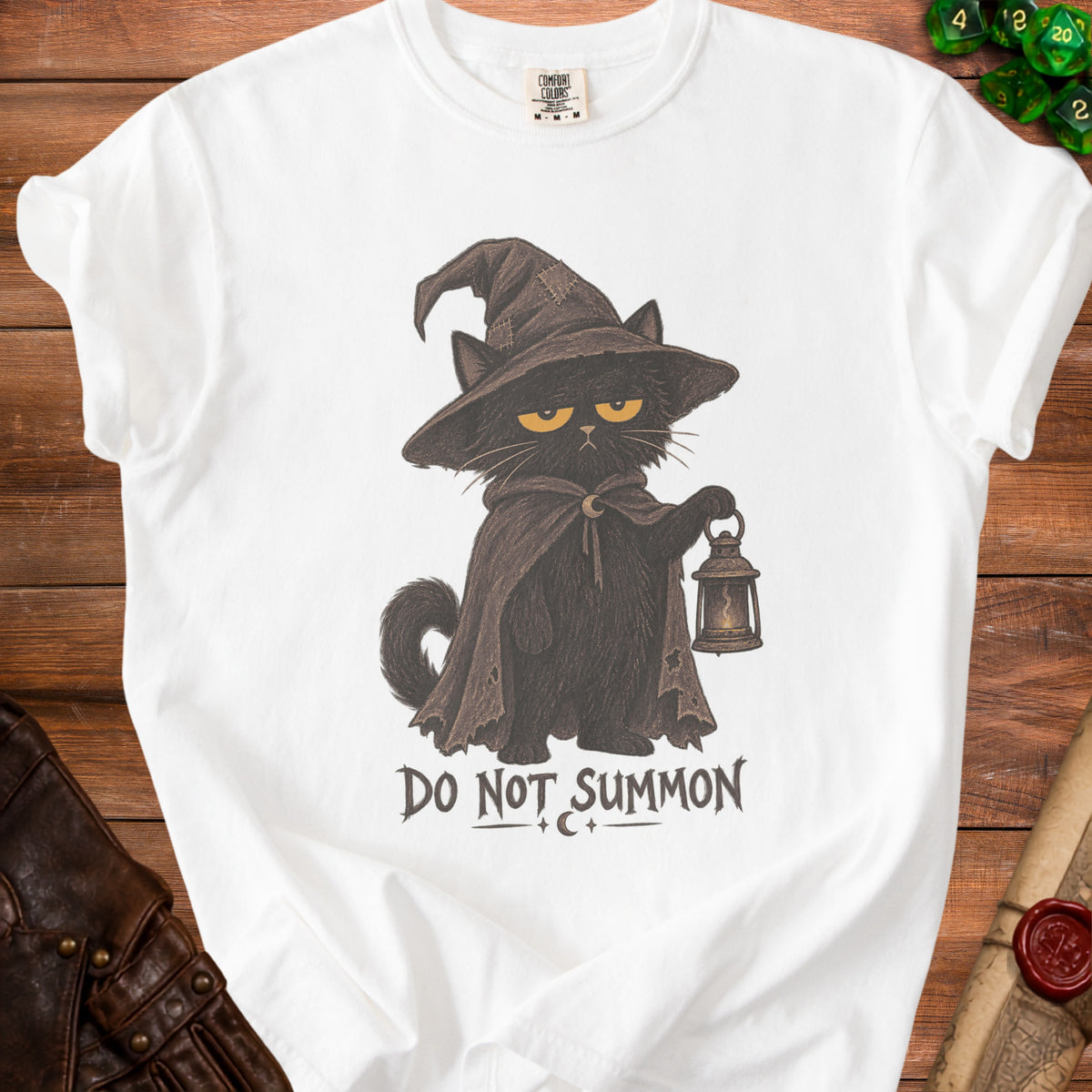 White t-shirt with a black cat in a wizard hat holding a lantern and text "DO NOT SUMMON".
