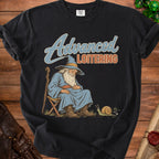 Black t-shirt with "Advanced Loitering" text and a wizard napping next to a snail.