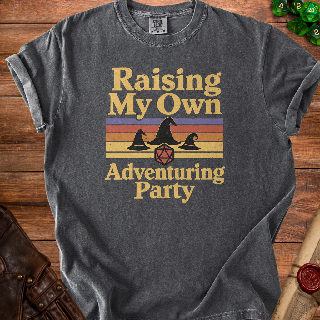 Dark grey t-shirt with "Raising My Own Adventuring Party" text and wizard hats.