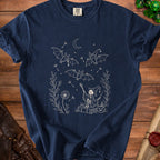Dark blue t-shirt with a cream outline drawing of bats, skeleton, and Halloween elements.