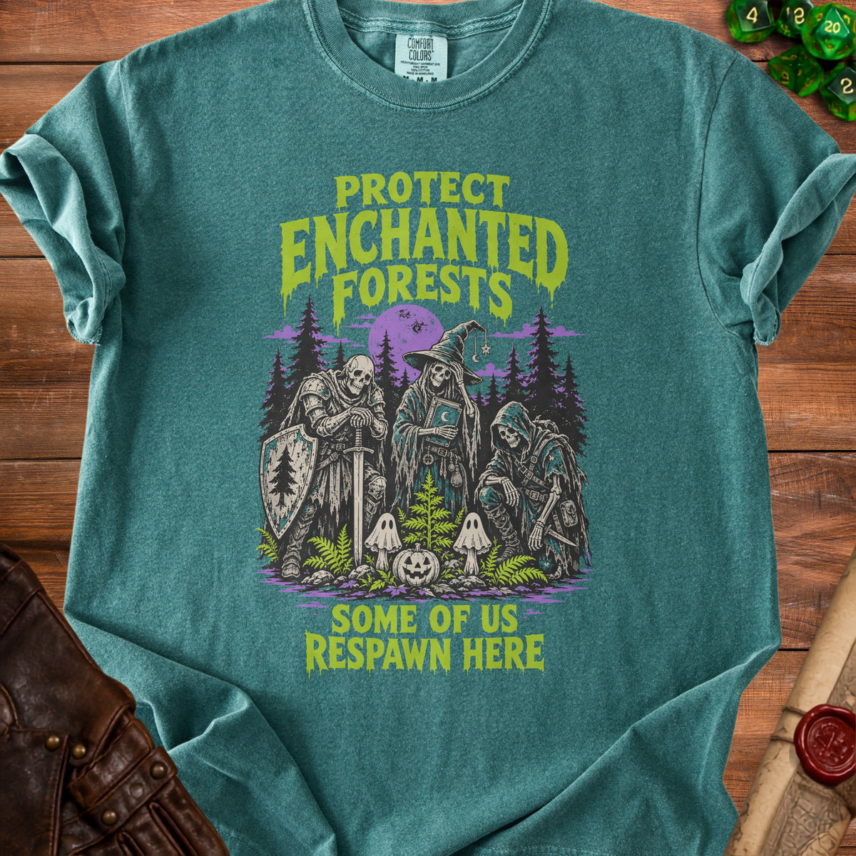 T-shirt with skeletons in armor and witch hats with "Protect Enchanted Forests" text.