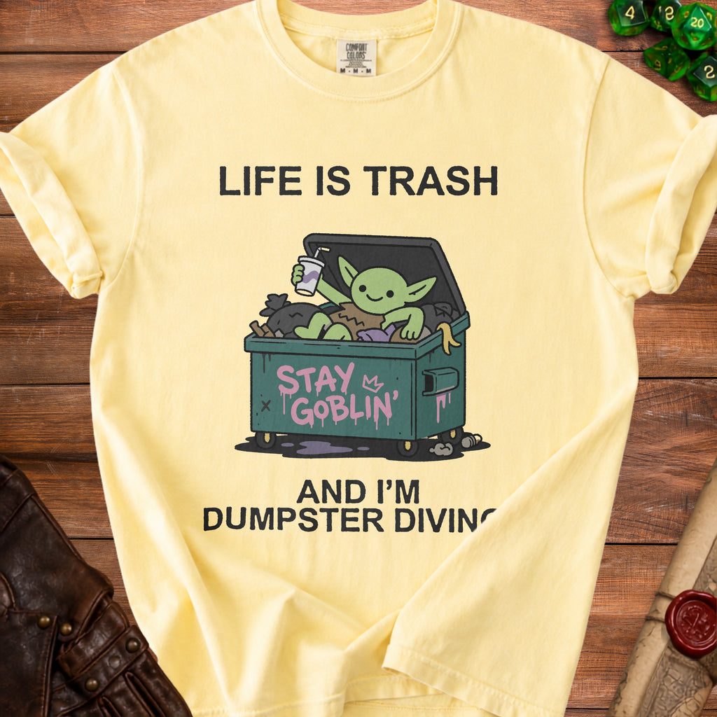 Yellow t-shirt with "Life is Trash" and a goblin dumpster diving.