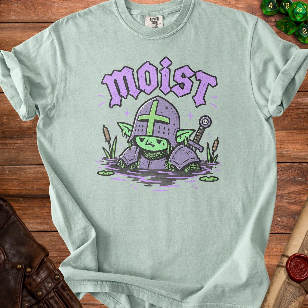 Light green t-shirt with a cartoon goblin knight in armor in water with the word "moist".