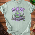 Light green t-shirt with a cartoon goblin knight in armor in water with the word "moist".